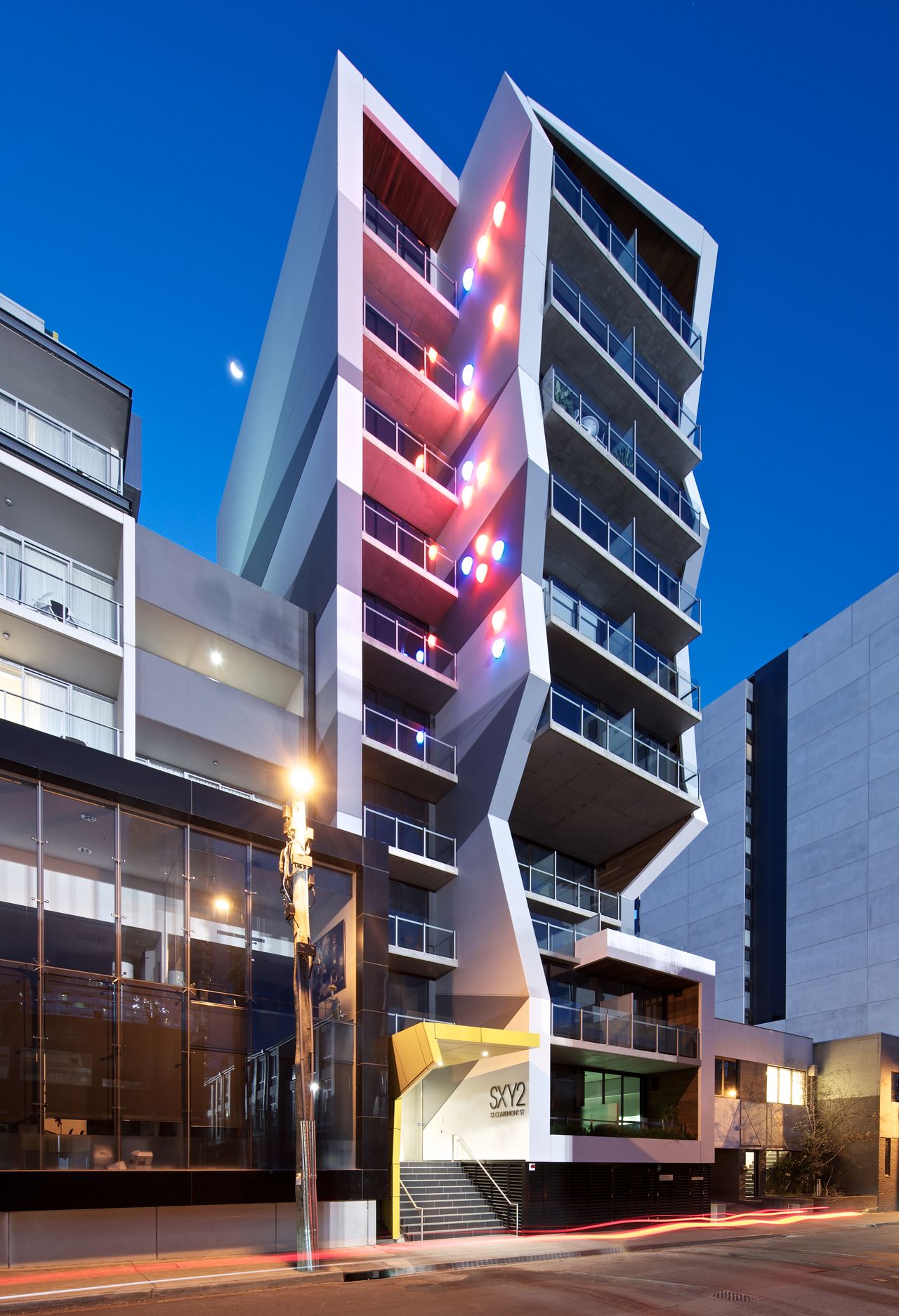 SXY2, South Yarra — the tower lit at night above Claremont Street